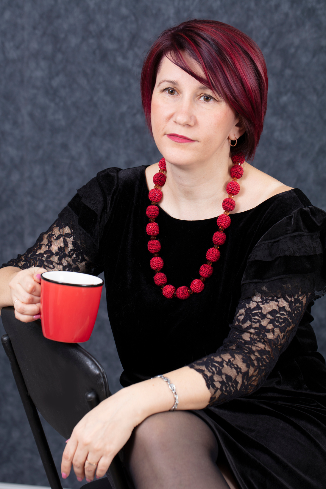 Middle-Aged Woman with a Red Coffee Cup 